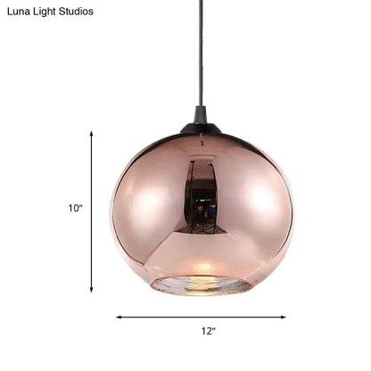 A sleek 10-inch tall modern rose gold copper sphere pendant light with a reflective glass globe and black cord