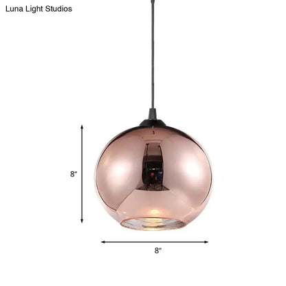Modern rose gold copper sphere pendant light fixture with reflective glass shade and black cord for kitchen bar use