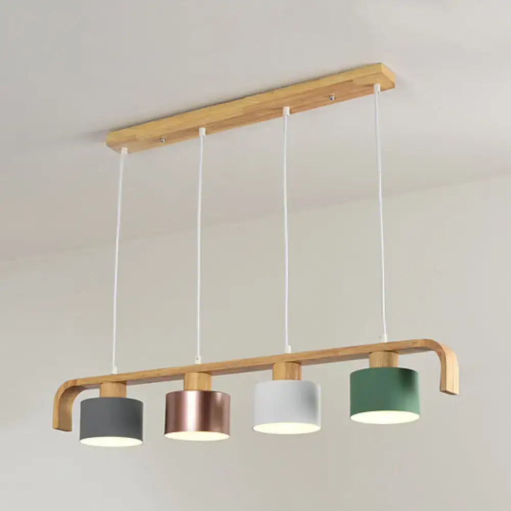 Modern rose gold drum island chandelier with natural wood frame and four gray rose gold white and green shades