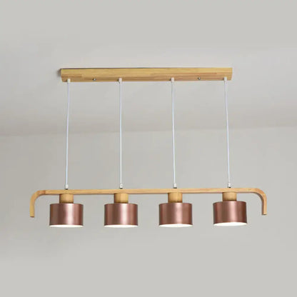 Modern rose gold drum island chandelier with copper-finished cylindrical pendant lights on light wood frame for dining table