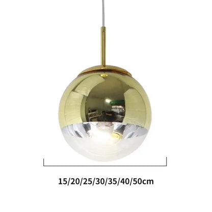 Modern rose gold glass ball pendant light with mirrored globe and brass hardware from decorbites pendant lights