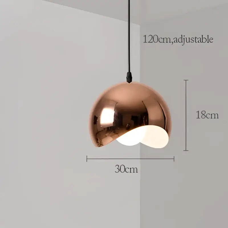 Modern rose gold pendant lights with copper-colored dome shape and adjustable metallic finish for dining room decorbites decor