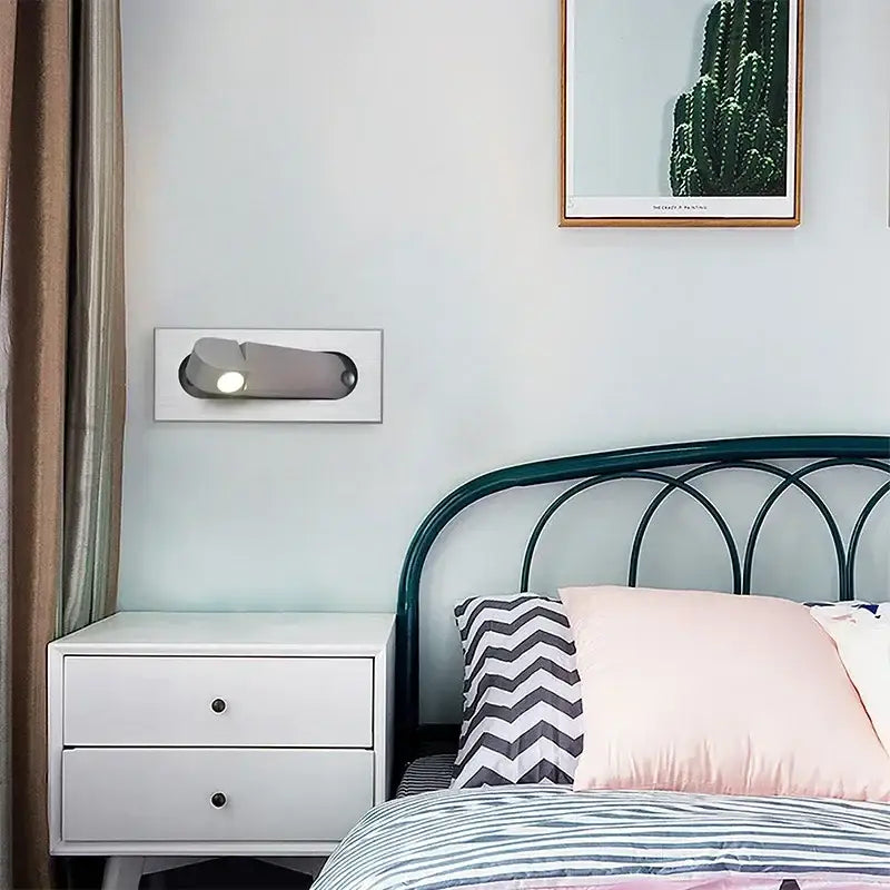 Modern silver wall lamp with sleek minimalist design made of rose gold and stainless steel for bedroom reading light