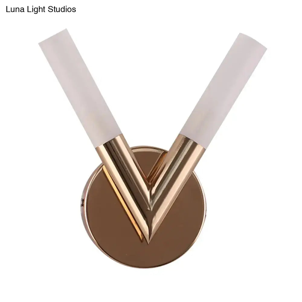 Modern rose gold v-shaped bedroom sconce with brushed metal and white glass shade for elegant lighting