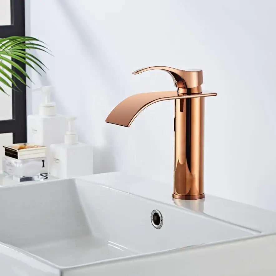 Modern rose gold single hole basin faucet with sleek curved spout and durable housing material for bathroom use