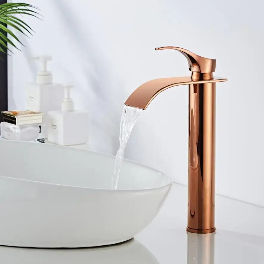 Modern rose gold single hole basin faucet with sleek waterfall design and durable housing material for bathroom use