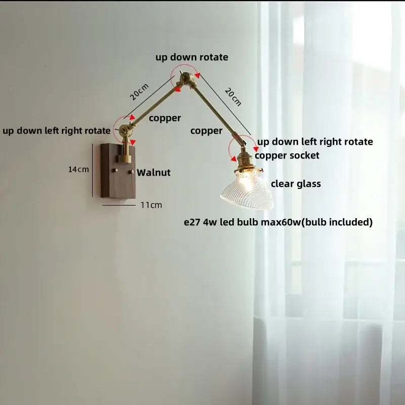 Adjustable copper wall light fixture with clear glass shade and walnut-finished mounting plate for modern interiors