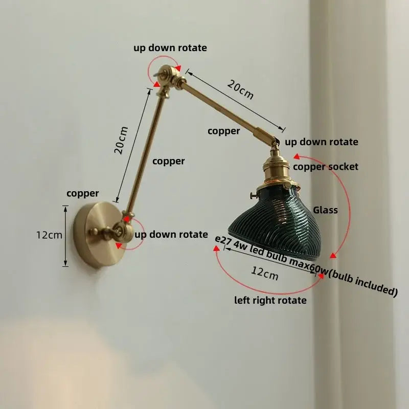 Adjustable copper wall light fixture with dark green ribbed glass shade and rotatable brass design for modern stair lighting