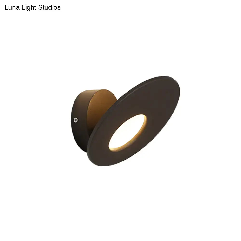 Modern matte black round acrylic integrated led wall lamp with circular disc design and warm light for bedroom use
