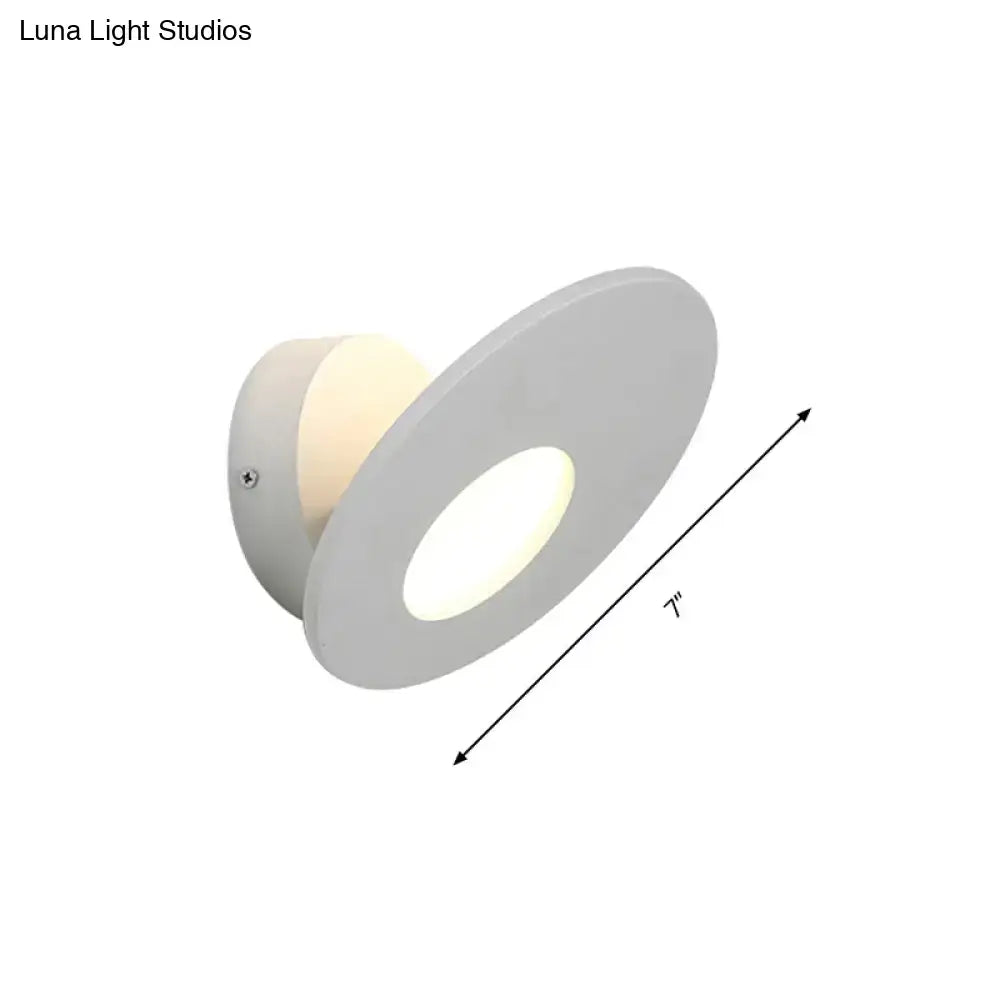 Modern round acrylic integrated led wall lamp with a white circular recessed design and illuminated center for bedroom use