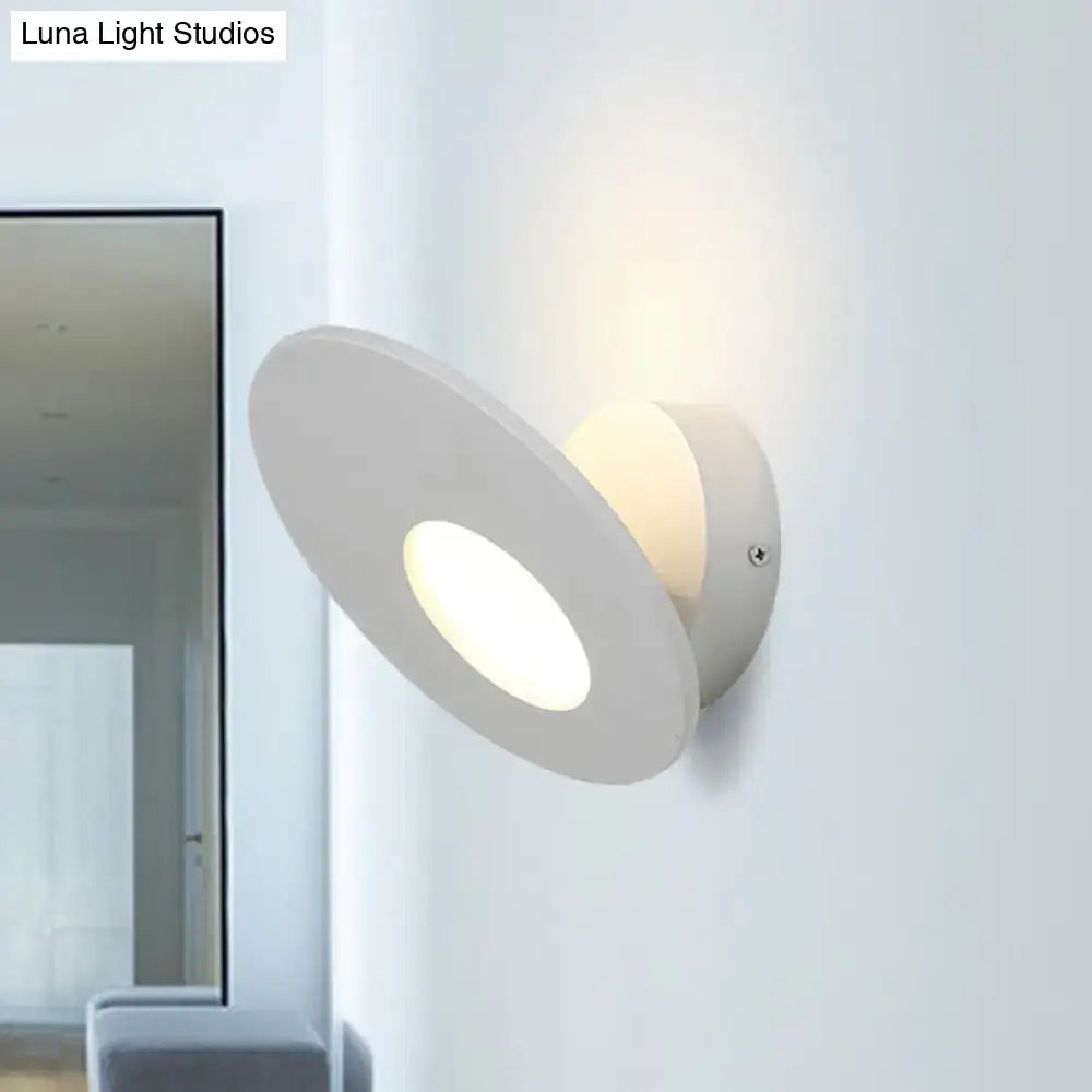 Modern round acrylic white wall lamp with integrated led and minimalist design providing soft ambient lighting