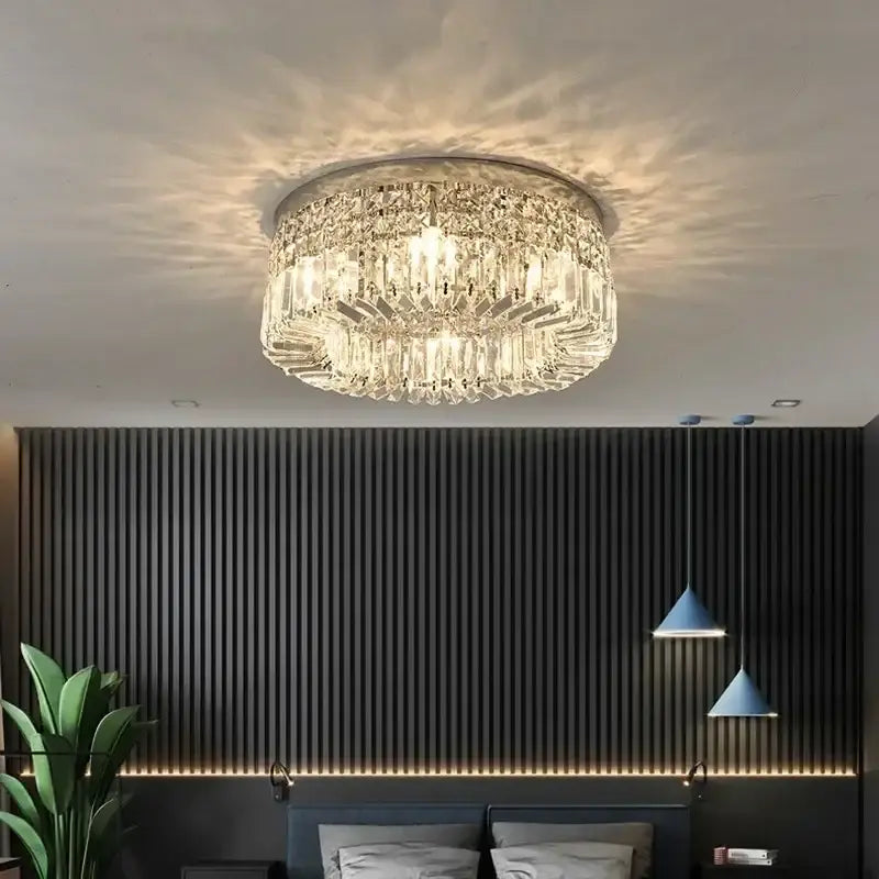 Modern round crystal led ceiling light featuring a circular metallic frame with tiers of faceted glass prisms decorbites crystal led