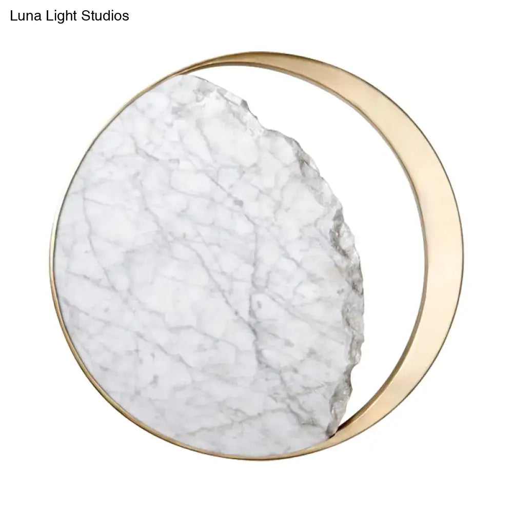 Modern round gold and white marble led wall sconce with a gold-toned metallic frame and white marble slab with gray veins