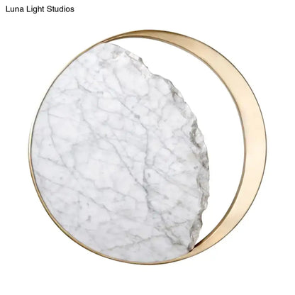 Modern round gold and white marble led wall sconce with a gold-toned metallic frame and white marble slab with gray veins