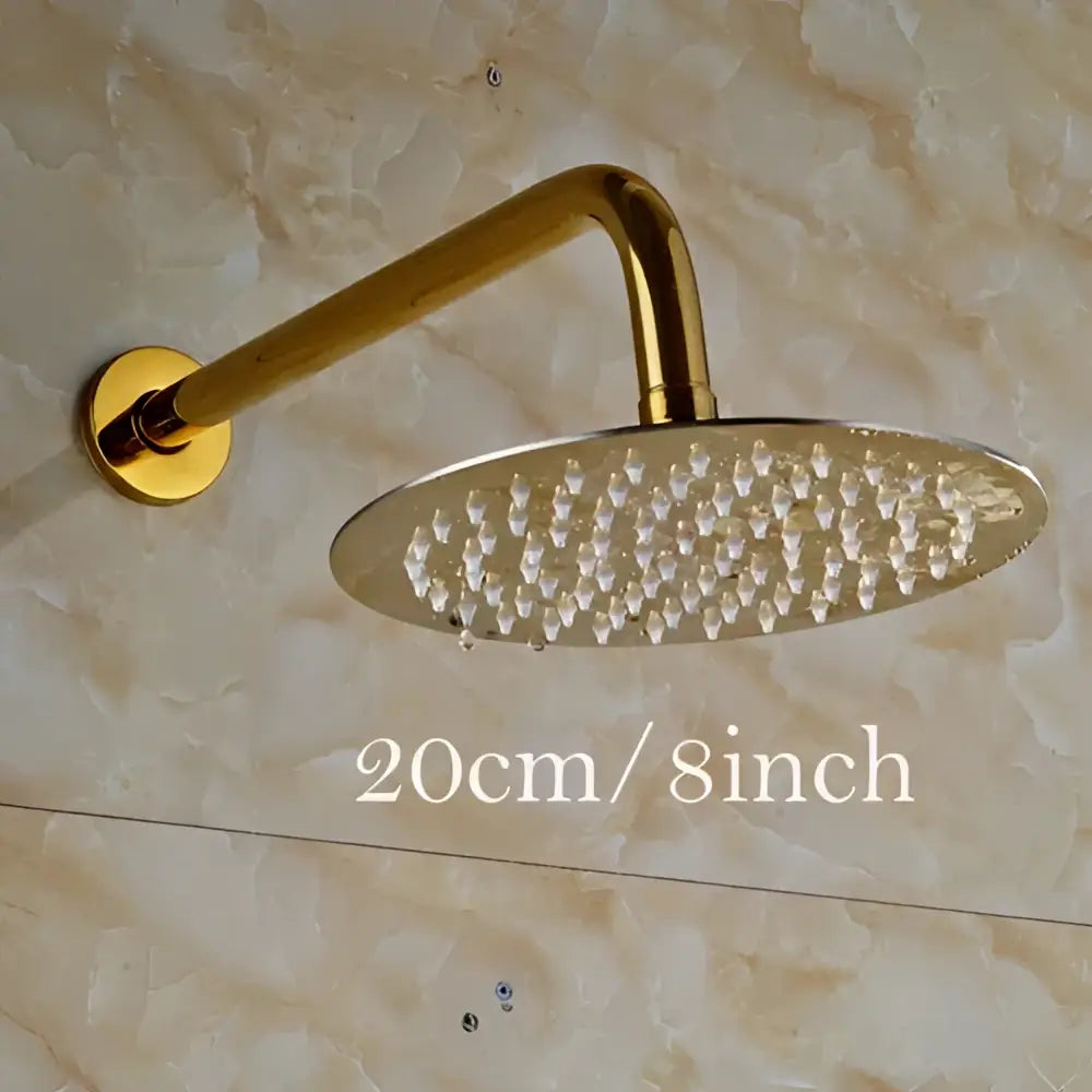 Modern round gold ultrathin rainfall shower head set with sleek metallic finish and multiple small nozzles for bathroom use
