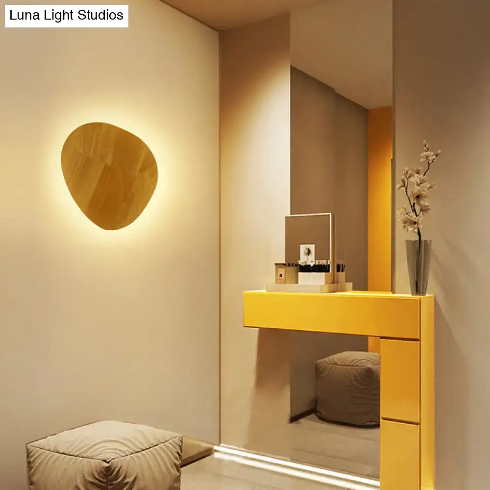 Modern round wood led wall lighting light fixture with warm-toned organic shape and smooth finish for living room