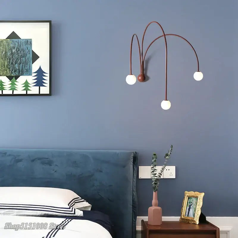 Modern copper-toned decorbites branch glass wall lamp with three curved arms and white spherical shades for bedroom sconce