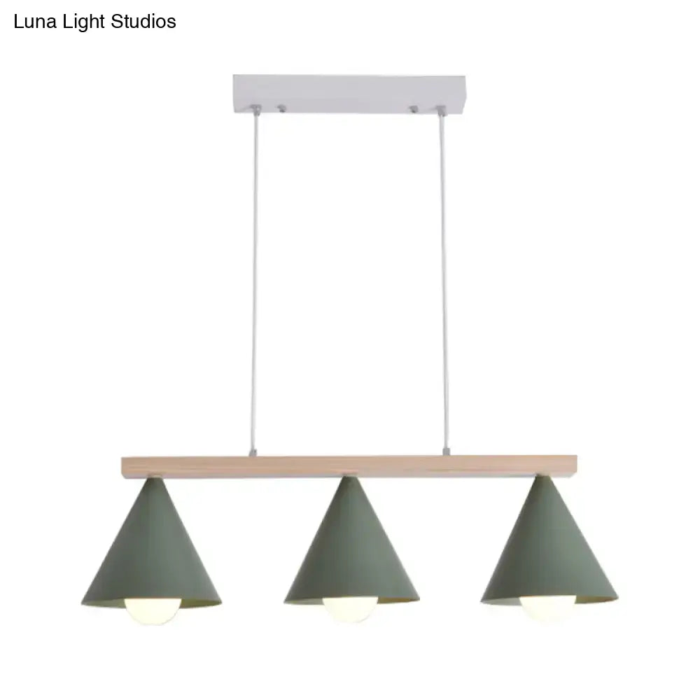 Modern DecorBites™ green iron island pendant ceiling light with three matte sage green conical shades on wood beam