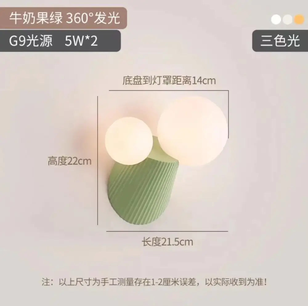 Modern sage green wall lamp with two frosted glass shades in a decorbites cactus resin glass bedroom light