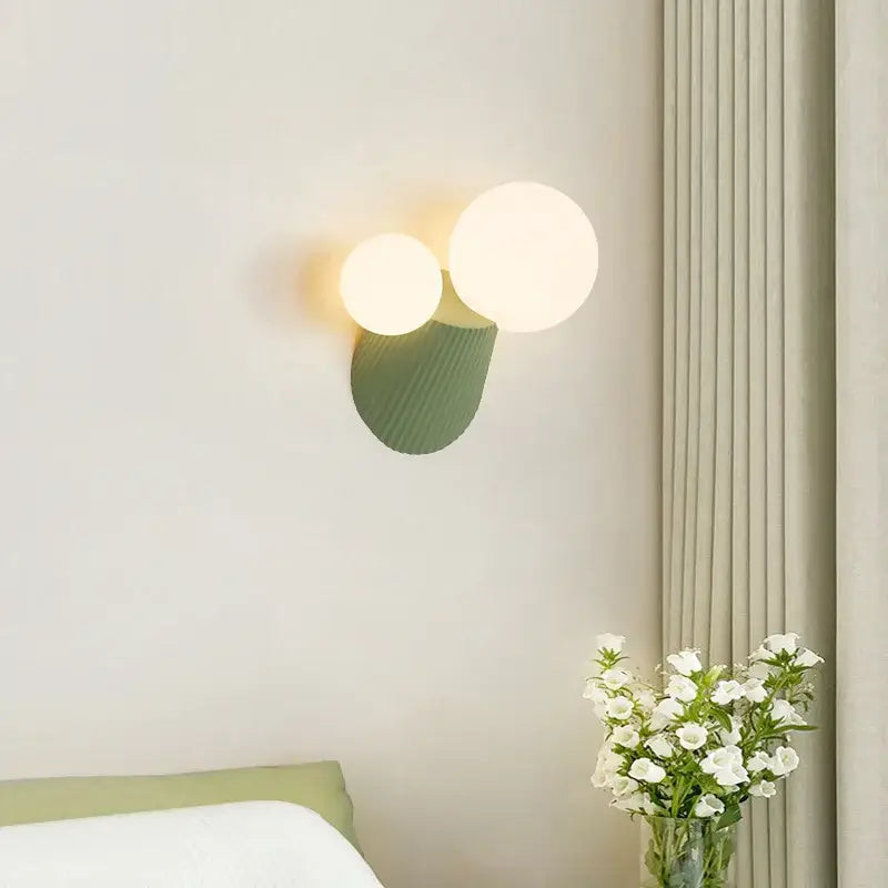 Modern sage green decorbites cactus resin glass wall lamp with two glowing spherical bulbs and textured base for bedroom