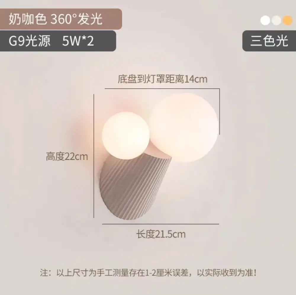 Cream-colored wall lamp with two spherical cactus resin glass shades and a textured ribbed base for bedroom decorbites