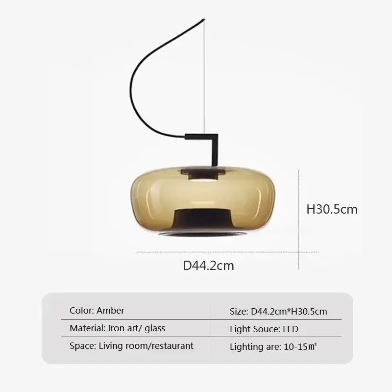 Amber-colored glass pendant lamp with sleek iron art fixture part of modern sage green glass pendant dining set of 3