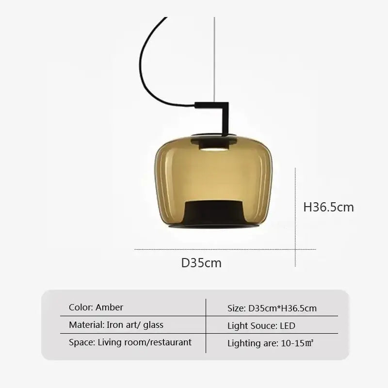 Amber-colored glass pendant lamp with sleek iron art fixture part of modern sage green glass pendant dining set of 3