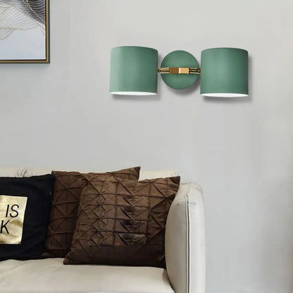 Modern sage green double shade wall sconce with brushed brass fixture direct wired for living room lighting