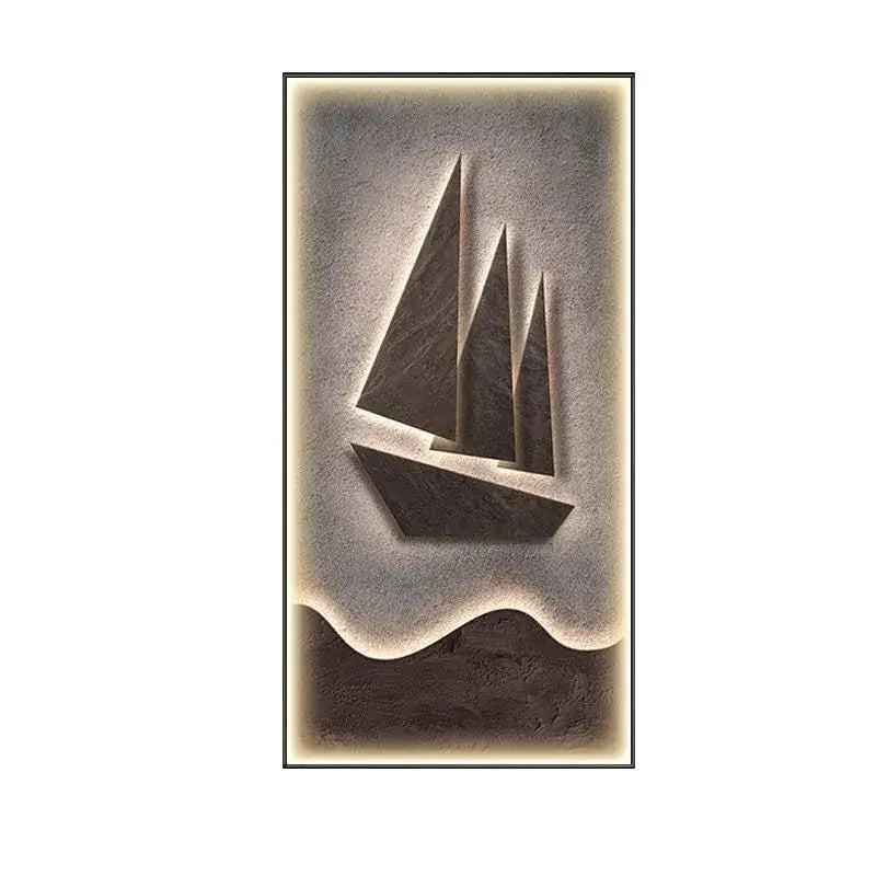 A sleek modern sailboat led wall lamp carved from dark stone with three triangular sails for living room decor