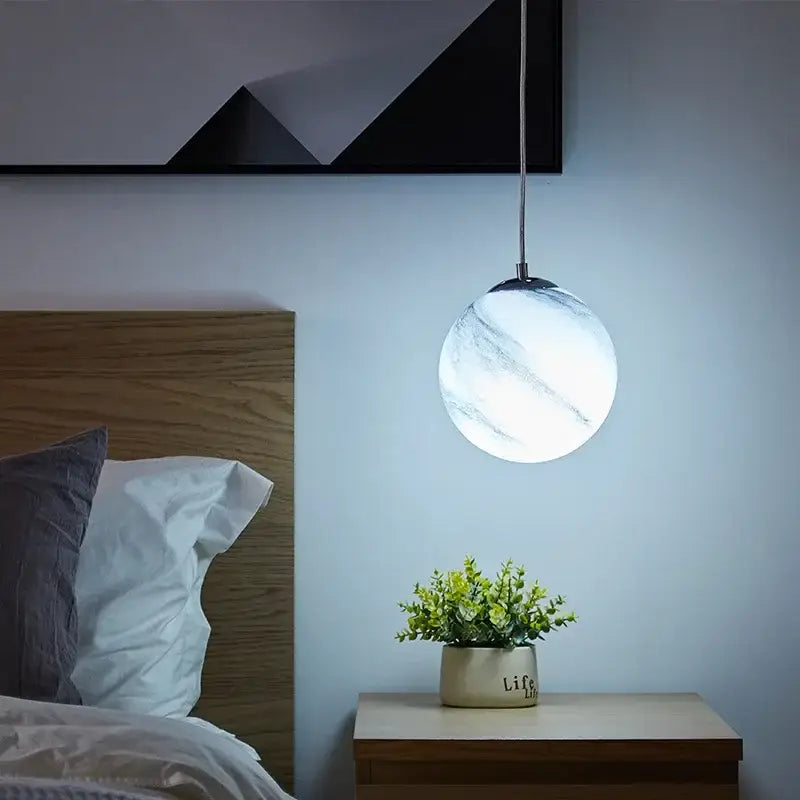 Modern saturn space star astronaut pendant lamp with a white marble globe and metallic chain for boys bedroom lighting