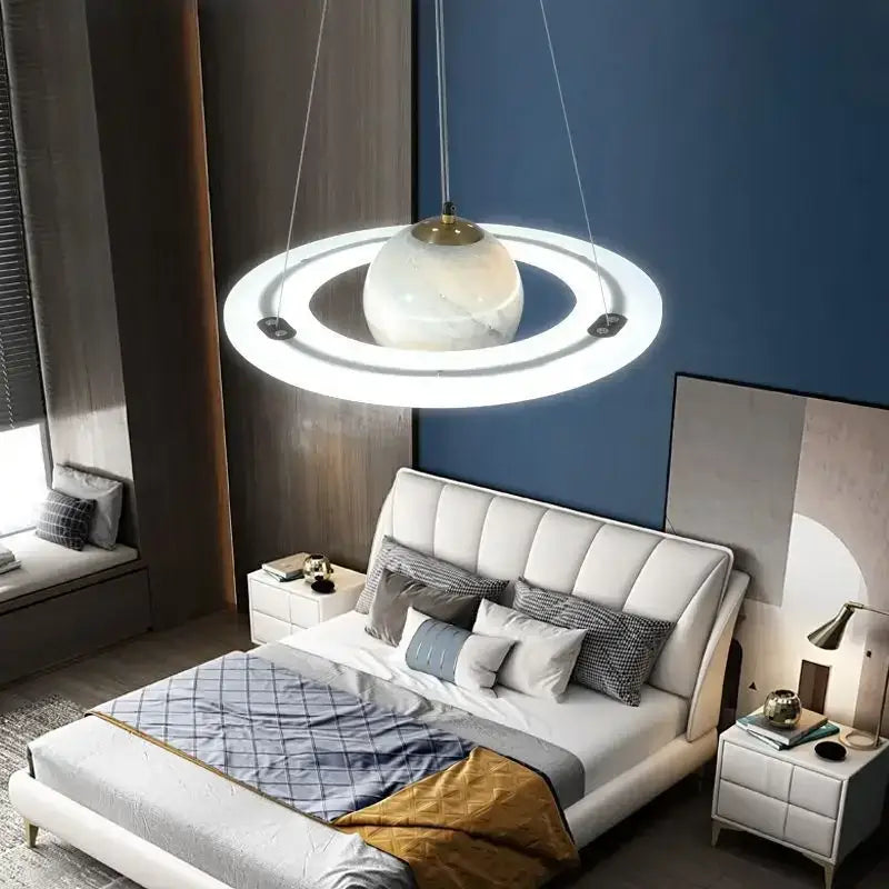 Modern pendant lamp with white marble sphere and glowing rings in boys bedroom star astronaut design
