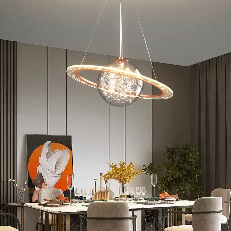 Modern saturn space star astronaut pendant lamp with clear glass sphere copper rings and intricate wirework for boys bedroom