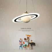 Modern saturn space star astronaut pendant lamp with textured off-white planet body and sleek black rings for boys bedroom