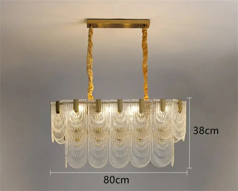 Modern scalloped art glass chandelier with clear fan-shaped glass panels and gold-toned metal decorbites art glass light