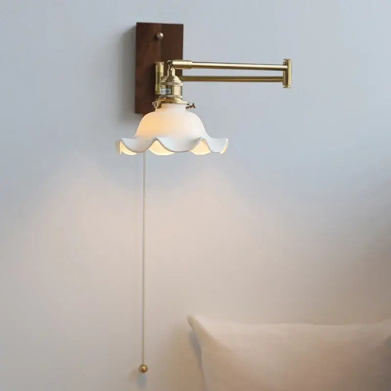 Vintage-style brass wall light with white scalloped glass shade and adjustable copper arm for bedroom reading decorbites ceramic led