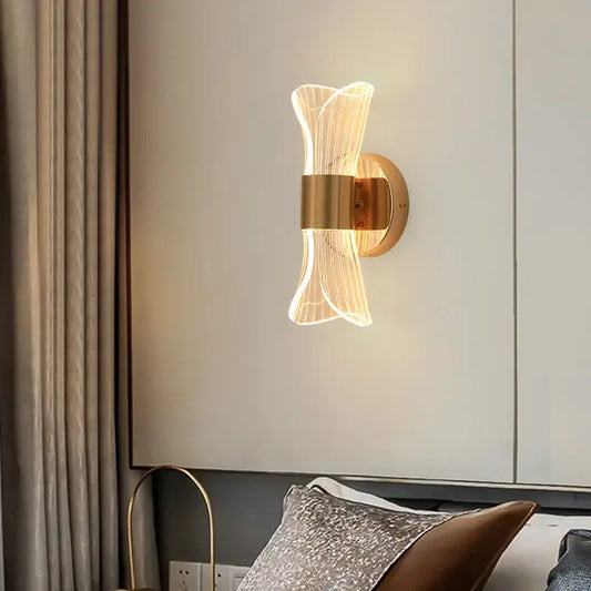 Modern sculptural gold nordic acrylic wall lights featuring translucent glass filaments emitting a warm glow
