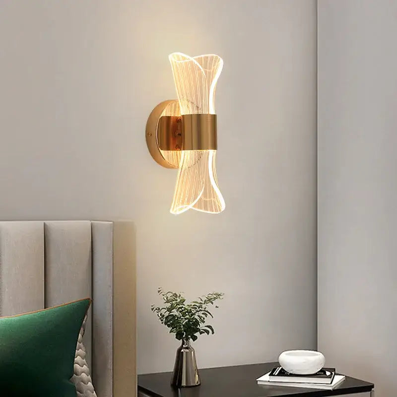 Gold-toned decorbites gold nordic wall lights with modern sculptural design and translucent ribbed acrylic panels for bedroom