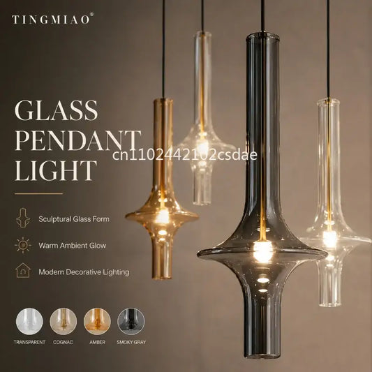 Modern sculptural glass pendant light in transparent cognac amber and smoky gray finishes for dining rooms