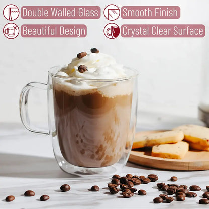 Modern set of 4 clear double wall glass coffee cup mugs filled with coffee topped with whipped cream and chocolate beans
