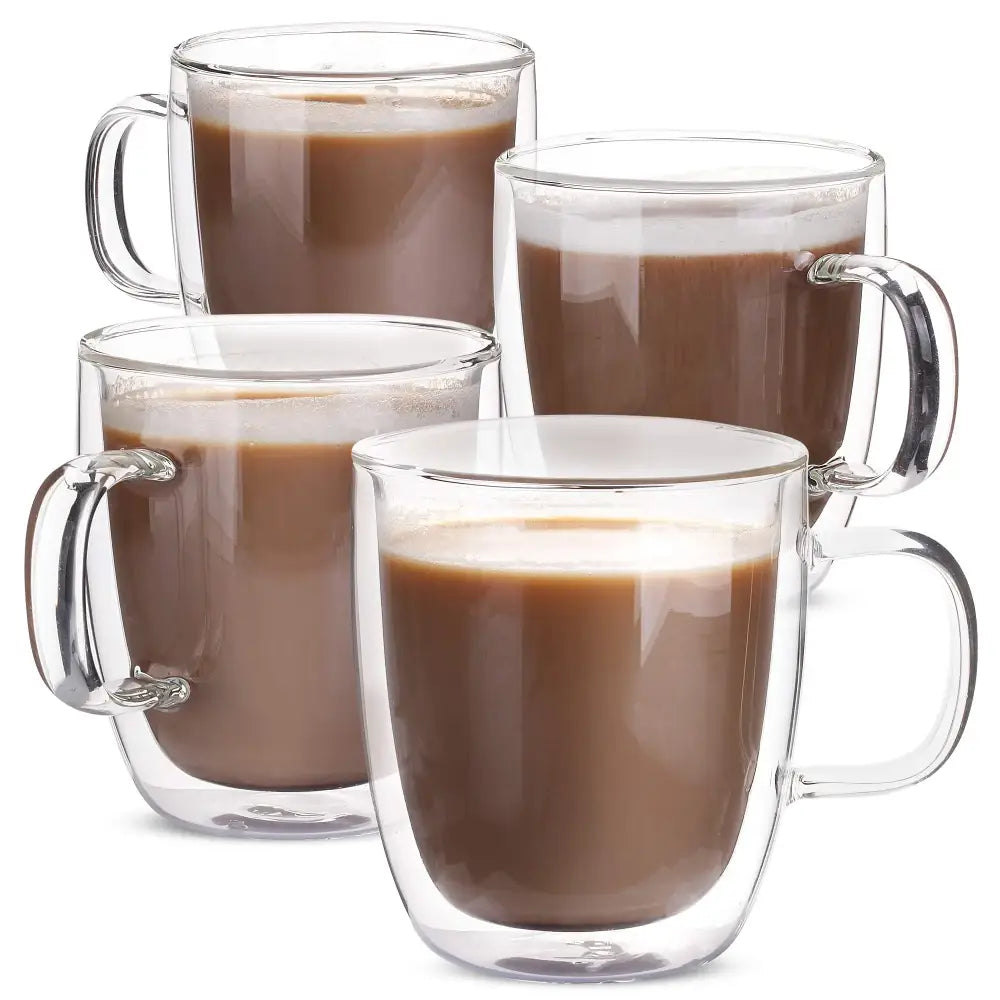 Modern set of 4 clear double wall glass coffee cups filled with chocolate milk for kitchen use
