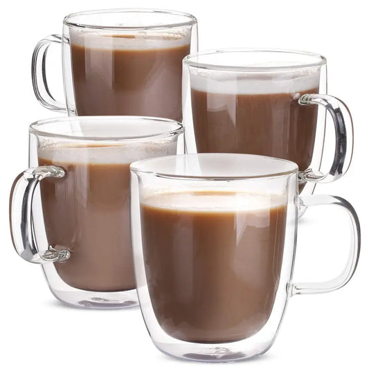 Modern set of 4 clear double wall glass coffee cups filled with chocolate milk for kitchen use