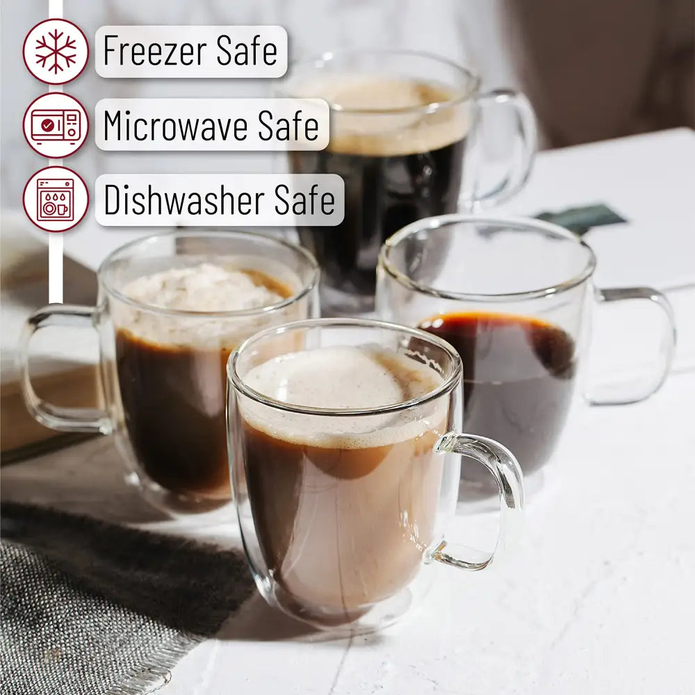 Modern set of 4 clear double wall glass coffee cups with sturdy handles filled with various brews for kitchen use