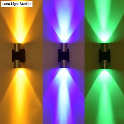 Modern silver aluminum dual-head wall light fixture with sleek metallic finish and vibrant colored accent lighting