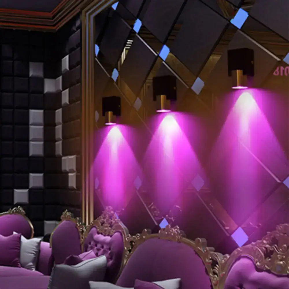 Purple velvet armchairs with ornate gold frames next to a modern silver aluminum led wall light fixture for bedroom accents