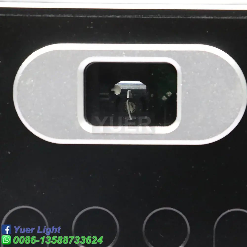 Silver oval camera lens housing set in black surface of modern silver and black decorbites 10w rgb laser light projector