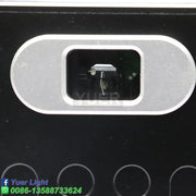 Silver oval camera lens housing set in black surface of modern silver and black decorbites 10w rgb laser light projector