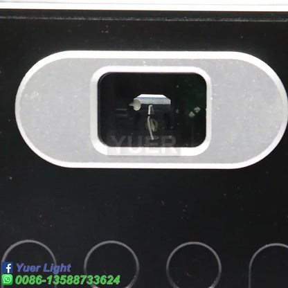 Silver oval camera lens housing set in black surface of modern silver and black decorbites 10w rgb laser light projector