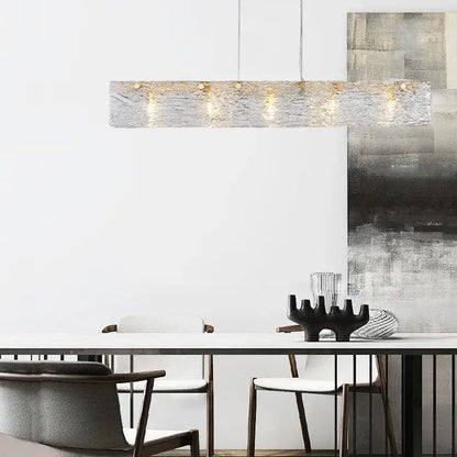 Modern silver and gold glass chandelier with textured rectangular pendant and warm-toned bulbs for dining room decorbites glass chandelier