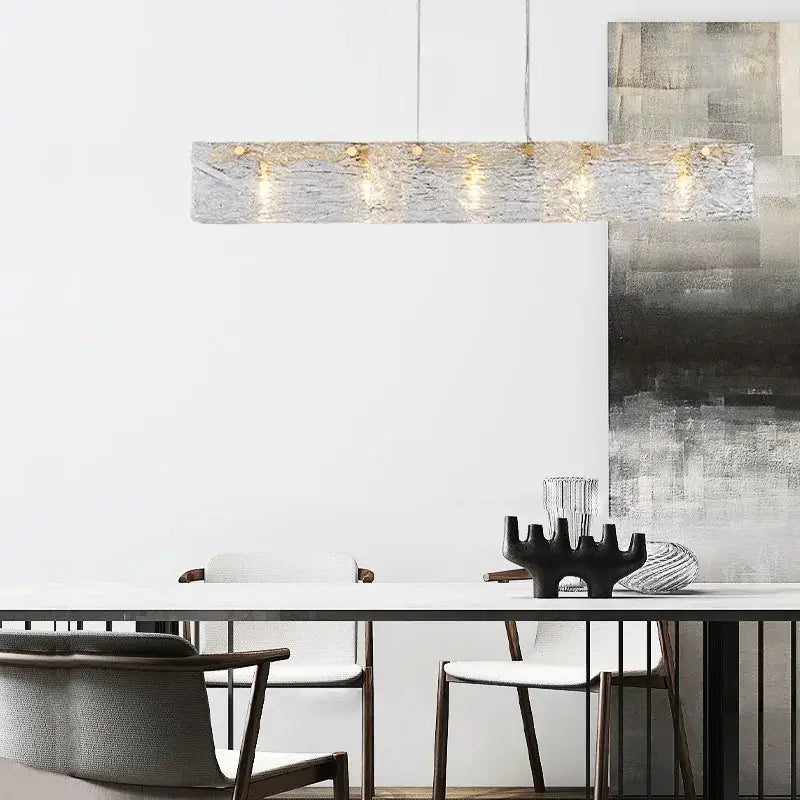 Modern silver and gold glass chandelier with textured rectangular pendant and warm-toned bulbs for dining room decorbites glass chandelier