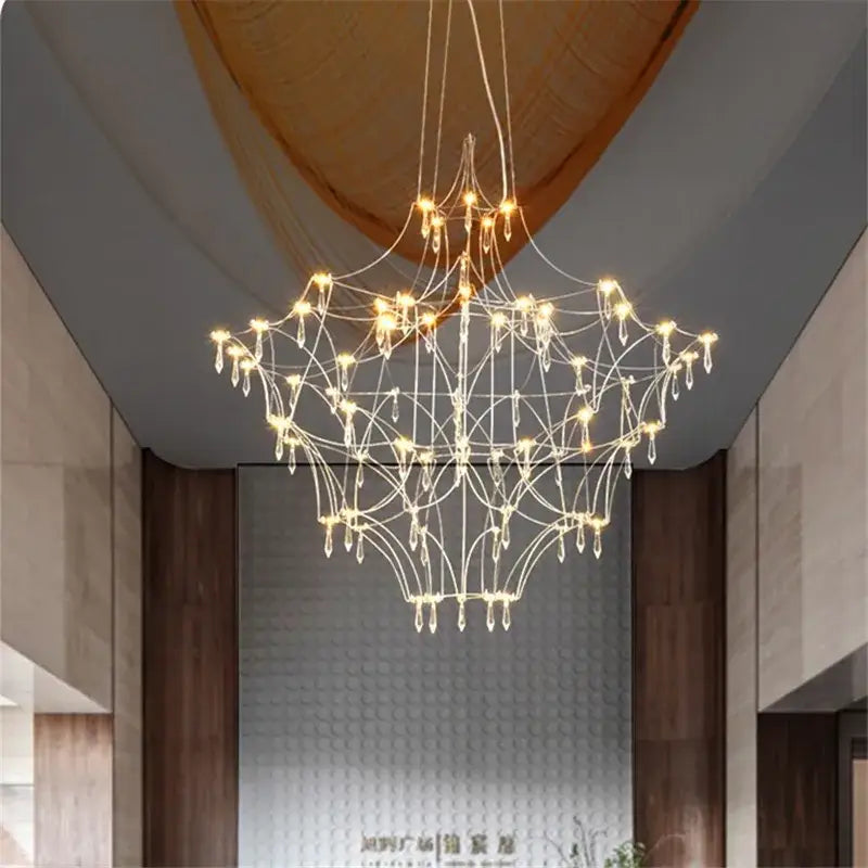 A modern silver and golden lustre crystal chandelier with a white metal frame and dangling crystal droplets for living room decorbites golden lustre